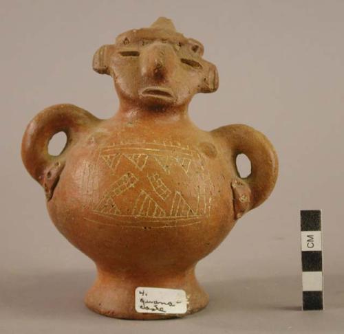 Red effigy incised vessel