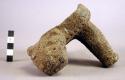 Stone metate fragment- one leg, part of platform and head of animal