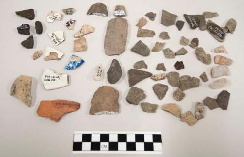 8 pottery, 2 pottery fragments, 1 glass, 1 potsherd blue glaze, chipping waste,