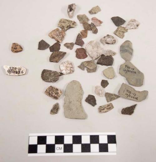 9 frags quartz & limestone; 32 fragments stone; 1 fragment pottery; 3 chips ston