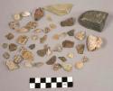 1 bag charcoal bits & dirt; 26 pieces quartz; 25 pcs stone; 1 broken rock labele