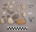 Fragment charcoal; 3 frags bone; 18 pieces stone; 112 pcs quartz; & quartz-like