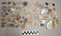 195 chipping waste; 40 bone fragments; 14 pottery and ceramics; 1 coal; 12 glass