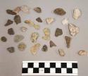 39 pieces stone; 1 bone fragment; 19 quartz frags