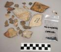 2 frags bone; 21 chips limestone & quartz; 91 chips stone; fragments charcoal