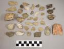 95 pieces stone; 2 stone frags labeled n9e1 24; 4 fragments unglazed pottery; 3