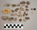 30 chips stone; 49 chips quartz & limestone; 1 fragment bone; 1 fragment charcoa