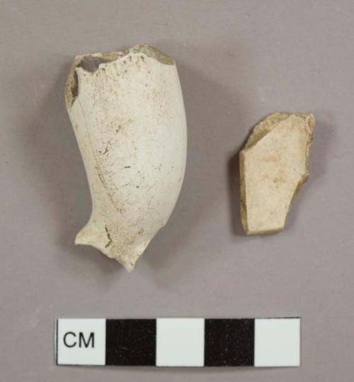 Kaolin/White ball clay pipe bowl fragments, one with ash residue inside