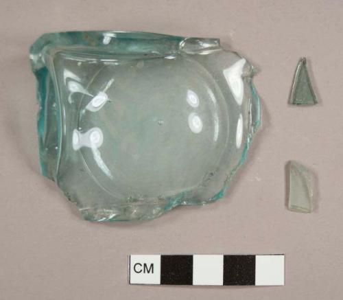 Aqua glass fragments, one curved, one flat, and one mold-made, square bottle base