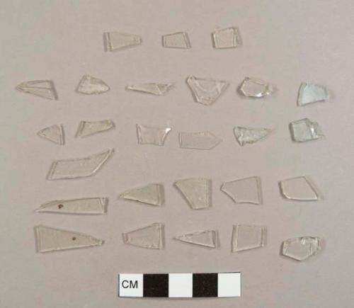 Colorless glass fragments, 25 flat fragments and one curved