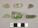 Green bottle glass fragments, including one bottle base fragment with partial kick-up