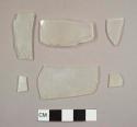 Frosted glass fragments, two curved and four flat glass fragments, at least one frosted after deposition