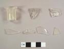 Colorless bottle fragments, including lip and neck fragments from two vessels