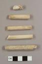 Kaolin/White ball clay pipe stem fragments with varying diameters (four with 5/64th-bore holes and one with a 6/64th-inch bore hole)