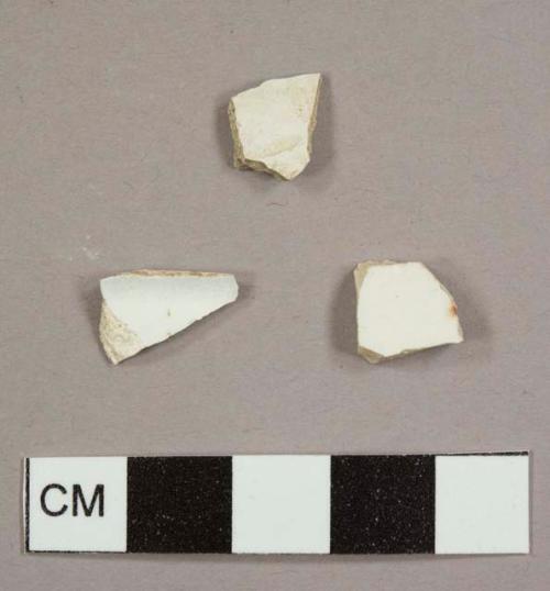Two whiteware sherds and one white ball clay/kaolin pipe bowl fragment