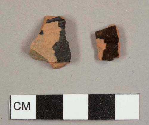 Black lead-glazed red earthenware sherds, one with molded ridges