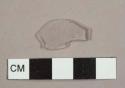 Colorless curved glass fragment, possibly  from a lamp chimney