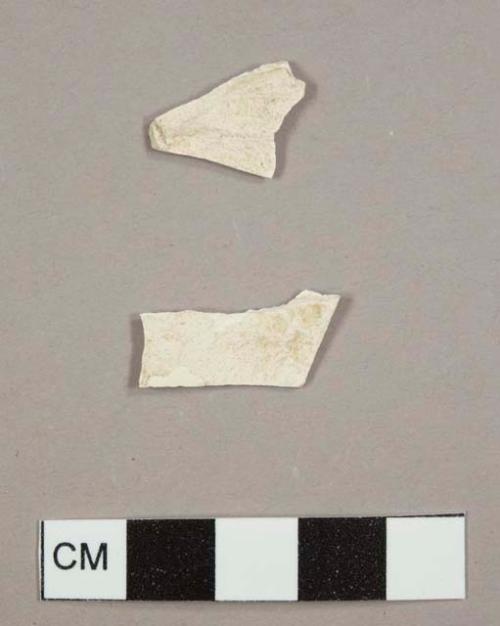 Creamware sherds, one with no glaze remaining