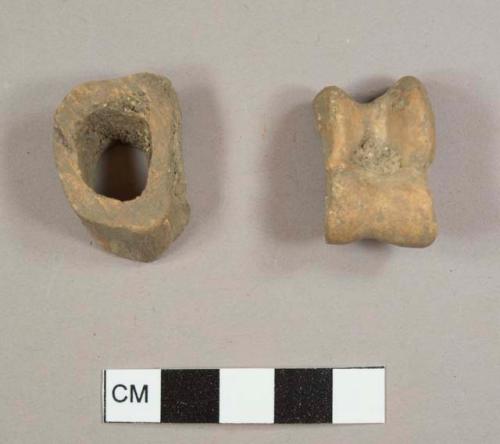 Bone fragments, one possible phalange and one cut, hollow bone fragment