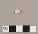 Tin-glazed earthenware sherd with white glaze and buff paste