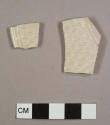 Stoneware, white salt-glazed, basketweave and barley pattern, plate sherds; mend together