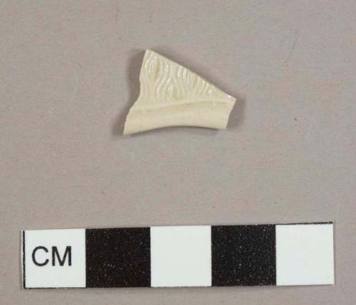 White salt-glazed stoneware plate rim sherd with "barley" pattern