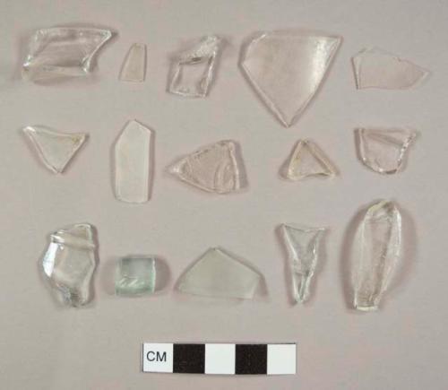 Aqua and colorless curved glass fragments including at least one rim sherd, possibly to a lamp chimney