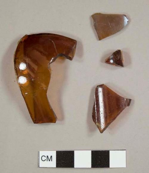 Amber curved glass fragments