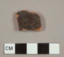 Black lead-glazed red earthenware sherd