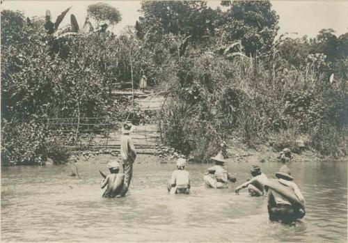 Subano men and Mr. Christie at the border of a smallpox quarantine