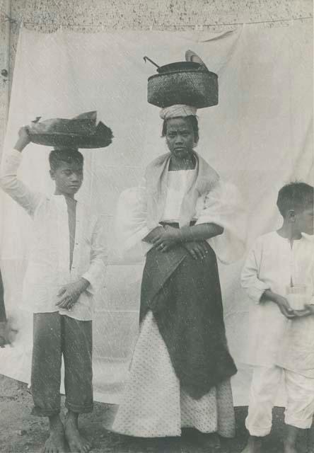 Tagalog girl and two boys with outfit for serving hot food