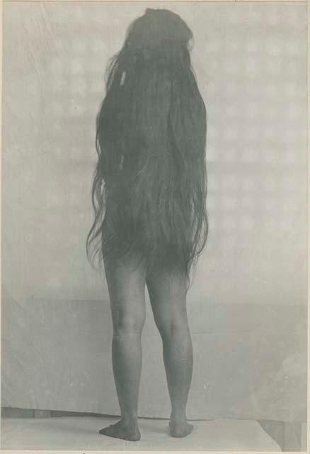 Tagalog woman with hair down, back