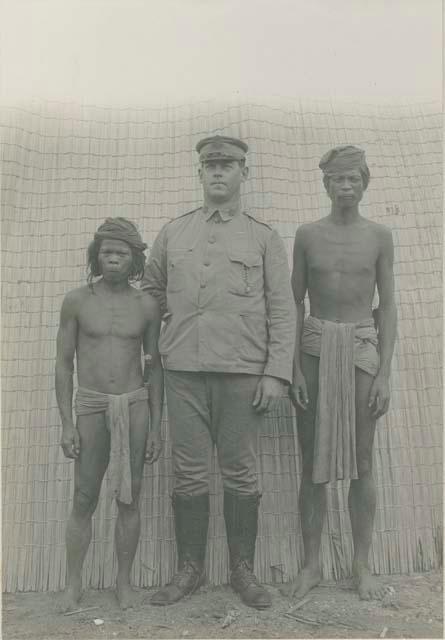 Two Tagbanua men and Governor Miller