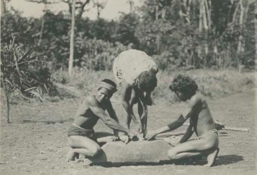 Tagbanua men making fire using method from Palawan