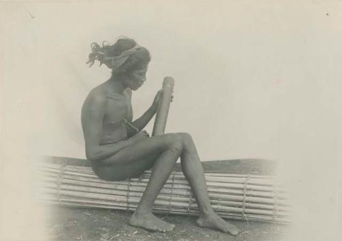 Tagbanua man writing on bamboo