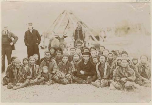 Group in front of a hut