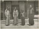 A Manchu bride and groom in wedding clothes with bride's two sisters