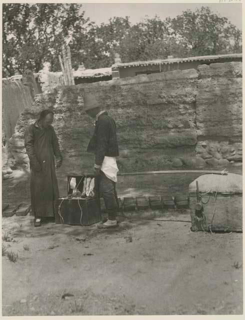 Traveling salesman selling goods to native