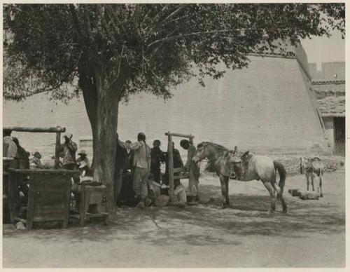 Blacksmith working under the trees in the Market Square