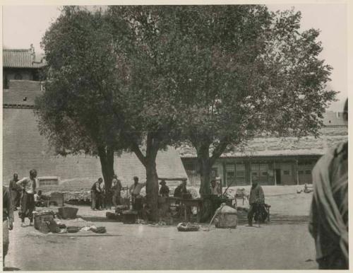 Merchants selling their goods under the trees in Market Square