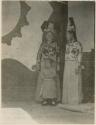 Two Manchu ladies and small boy all in ornate clothing