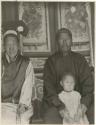 A Manchu family including two adults and small child