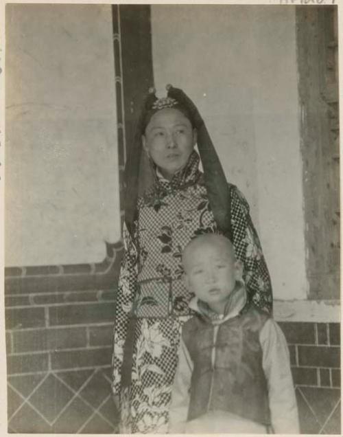 Woman standing with her son