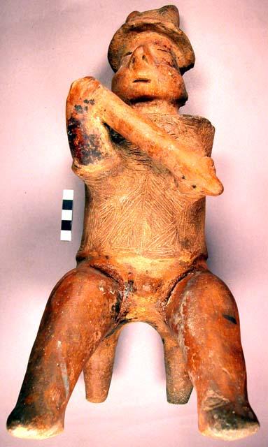 Terra cotta human figure, seated