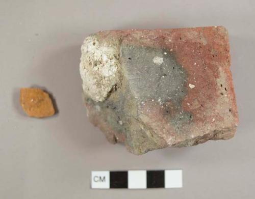 Brick fragments, one with mortar