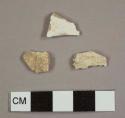 Whiteware sherd and two pieces of clinker
