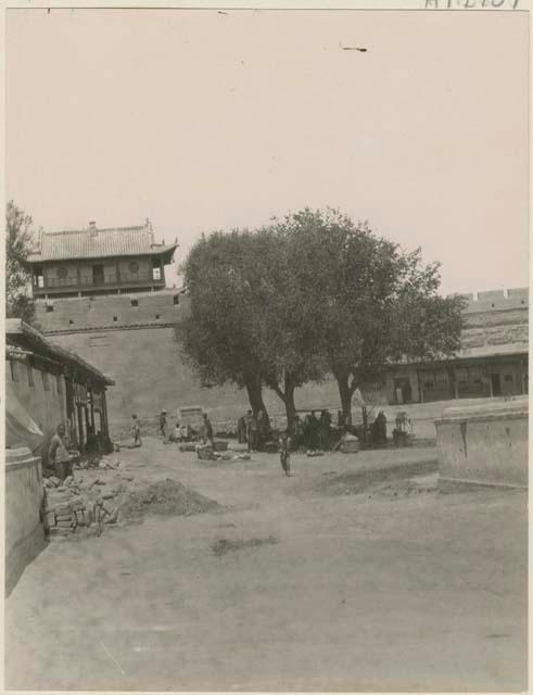 Watch tower and merchants under tree