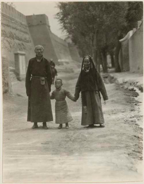 Family walking by walls