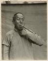 Portrait of Chinese teacher and transport manager with pipe
