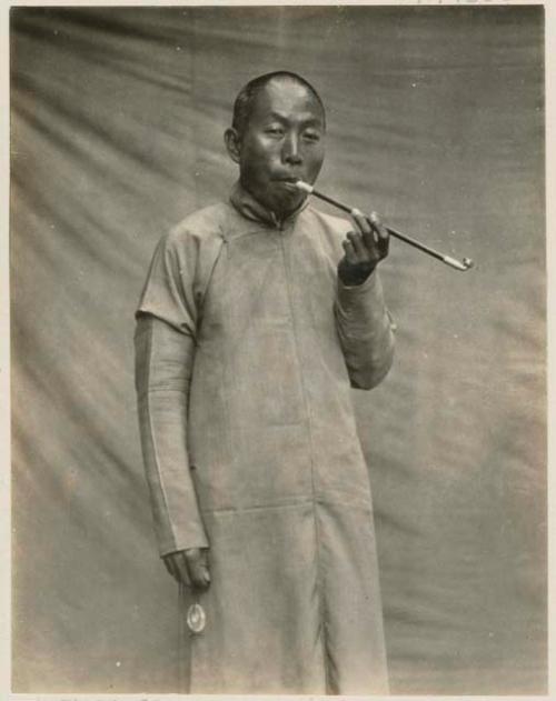 Chinese teacher and transport manager with pipe